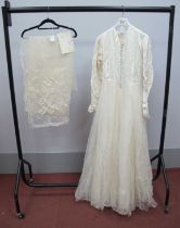 A Circa 1950'S Wedding Dress, the cream damask fitted bodice with centre front button fastening