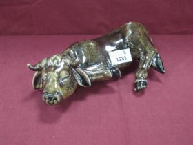 Anita Harris Figure of a 'Lying Cow' (part overhangs on shelf) gold signed, 22cm long.