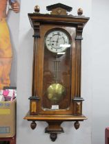 XIX Century Walnut Vienna Wall Clock, with an enamel dial, Roman numerals, arched glazed door,