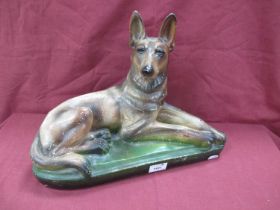 Early XX Century Painted Plaster Figure of a Seated German Shepherd Dog, 30cm high.