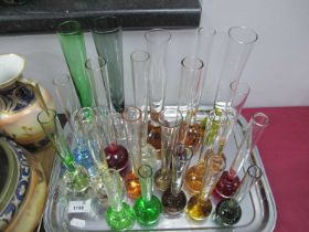 Glass Bud Vases, in varying colours, the largest 25.5cm.