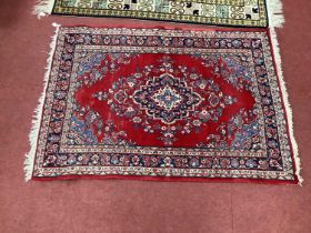 Middle Eastern Tassled Wool Rug, with floral decoration in the Indian manner, with large central