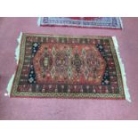 Adedis Kashmir Tassled Woold Rug, with four large elongated central motifs, stylized tree on border,