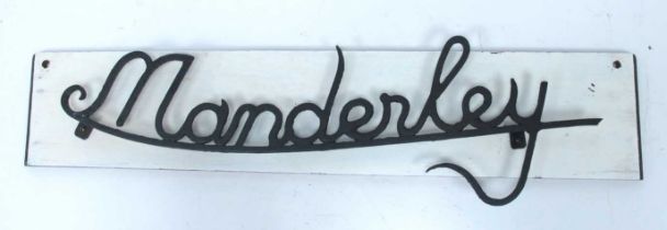 A Vintage Metalwork House Sign "Manderley", on wooden plaque (overall length 81cm).