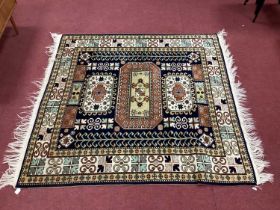 Middle Easter Wool Tassled Rug, with Aztec style motifs and three central panels to black ground,