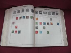 Stamps; An early World stamp collection housed in a deluxe gilt-edged 'Challenge' album, sparsely