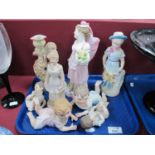 Four Piano Babies (one damaged). four continental bisque figurines, the tallest 23cm:- One Tray