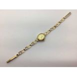 H. Samuel; A 9ct Gold Cased Ladies Wristwatch, the signed oval dial with line markers, within