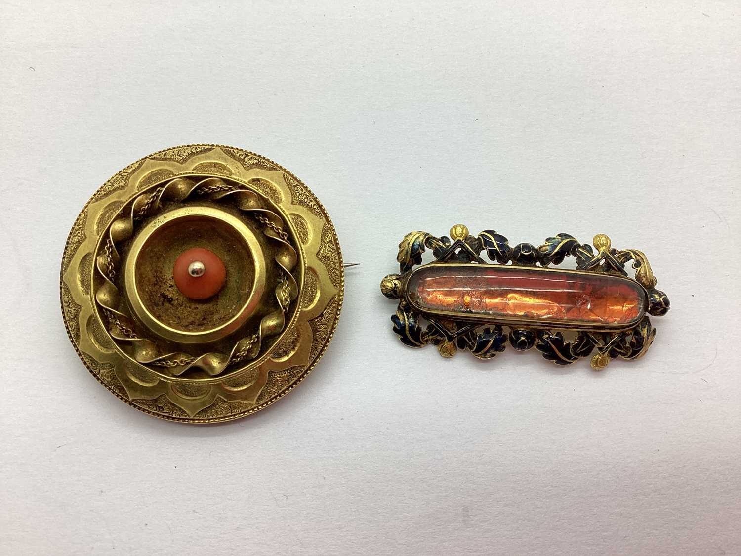 An Antique Brooch, detailed with black enamel (enamel loss) the reverse with hinged compartment,