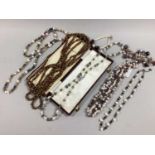 A Modern Opera Length Single Strand Brown Freshwater Pearl Bead Necklace, together with further