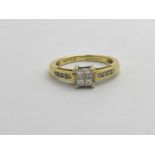 An 18ct Gold Stone Set Ring, the four princess cut centre stones to four claw setting, between