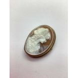 A Hallmarked 9ct Shell Cameo Brooch, the ornately carved portrait of a lady, set within twisted