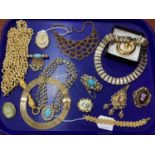 Gilt Metal Costume Jewellery, including necklaces, textured bracelet, brooches, etc :- One Tray