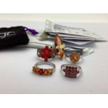 A Collection of "925" TGGC Stone Set Dress Rings, including Ethiopian cherry opal and Songea