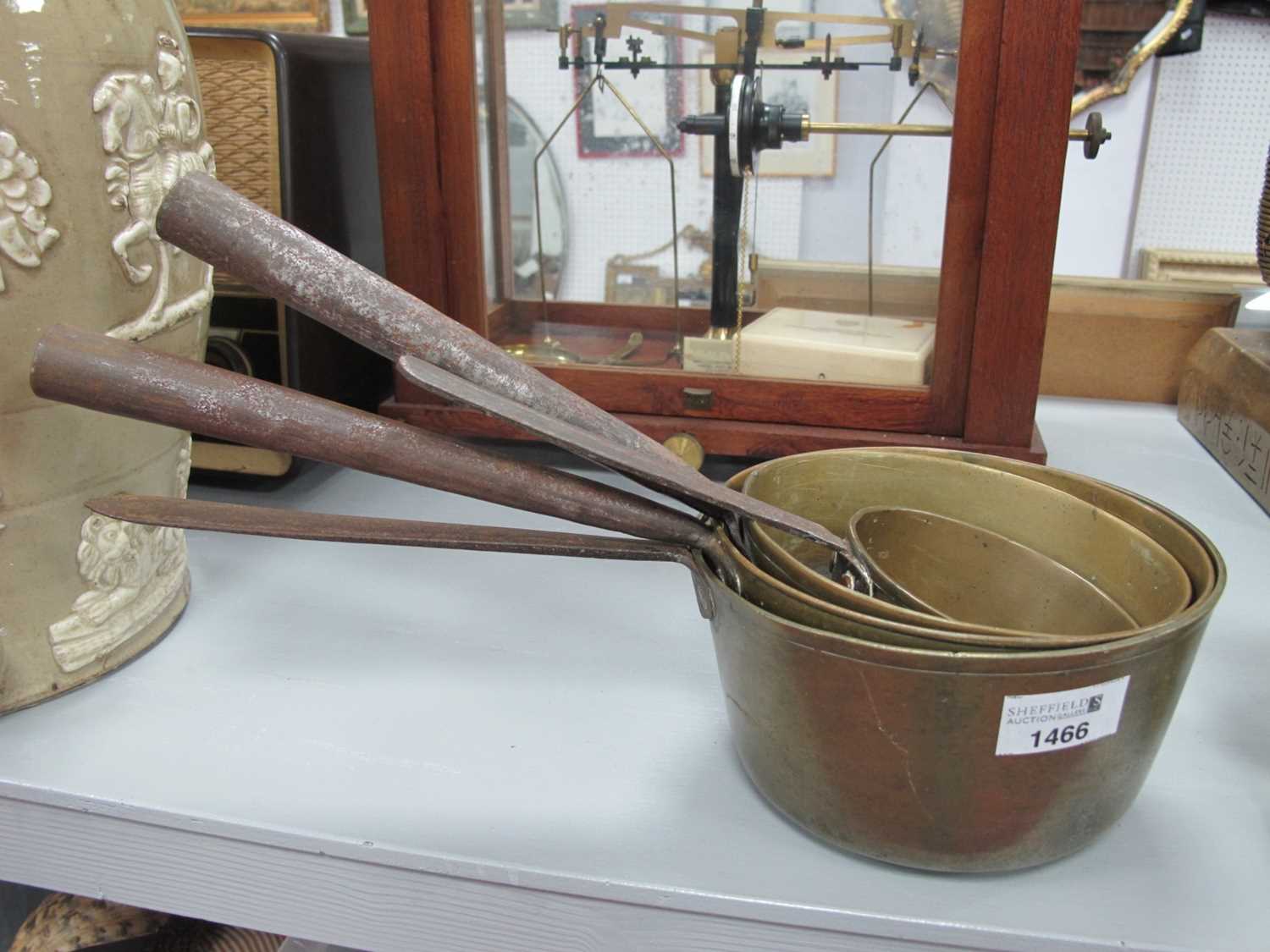 Four XIX Century Brass Jam Pans, with iron handles, the largest 17cm diameter.