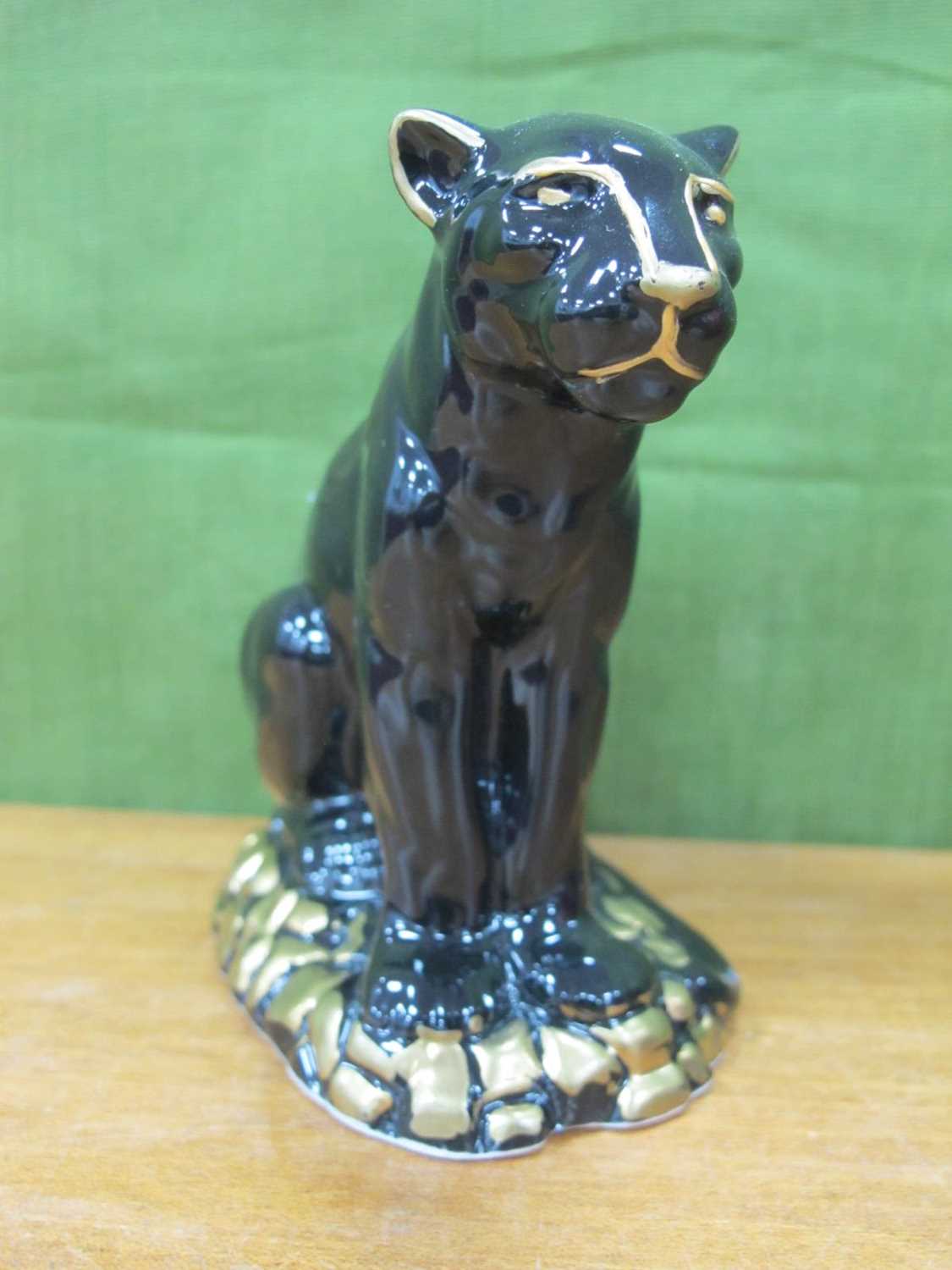 Anita Harris Model of a Black and Gold Puma, gold signed, 11cm high, 10cm long.