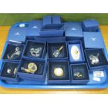 Nine Swarovski Crystal Miniatures, including pram, champagne bottle, plant pot, cake, garden tug,