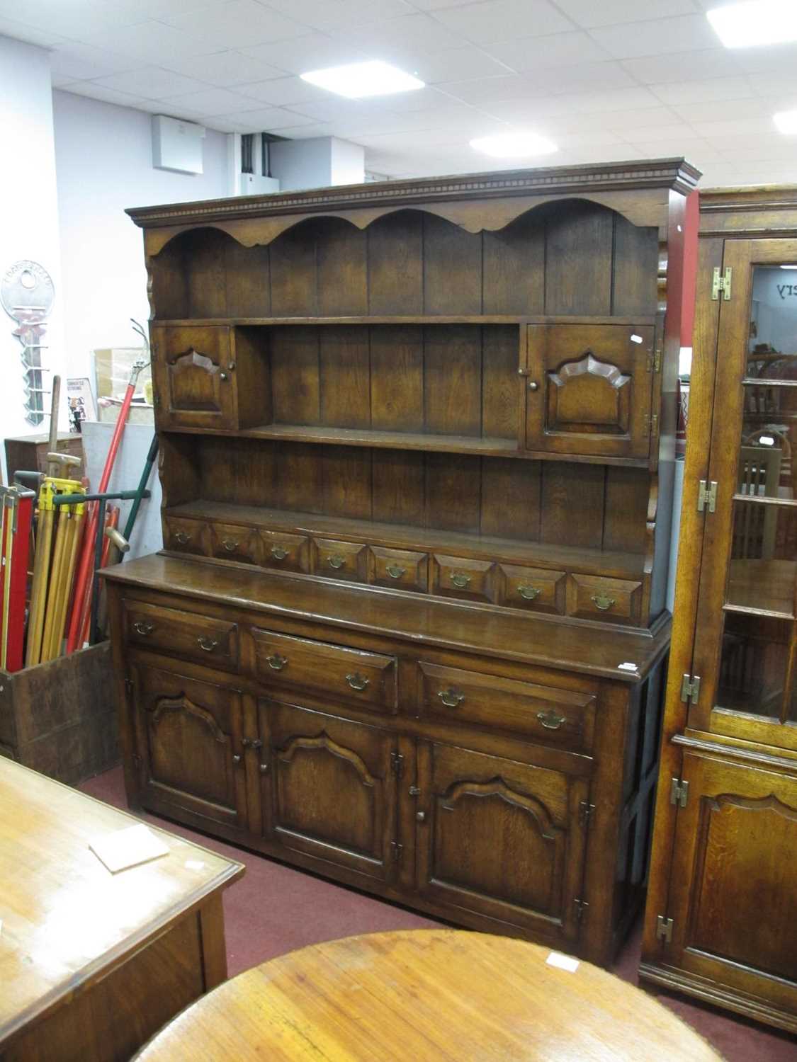 XVIII Century Style Oak Dresser, rack with a dentil cornice, twin panelled cupboard doors, eight