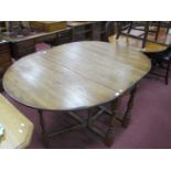 An Oak Drop Leaf Table, with double gateleg action base, 120cm wide.