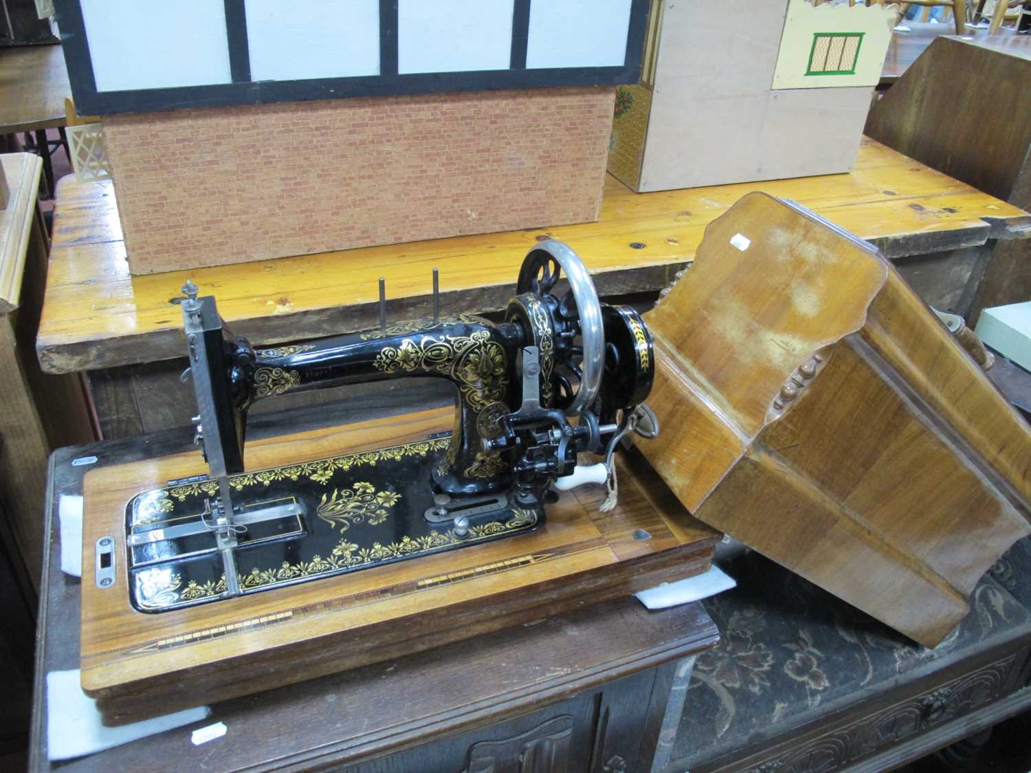 W J Harris & Co London Sewing Machine, in a walnut case.