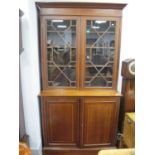 An Early XX Century Edwardian Inlaid Mahogany Bookcase, with a stepped pediment, glazed astragal