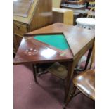 An Edwardian Mahogany Inlaid Envelope Table, with swivel top, green baized interior with guinea