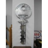 A Contemporary Aluminum Coat Rack, designed as a large vintage latch key with motif "Coats and