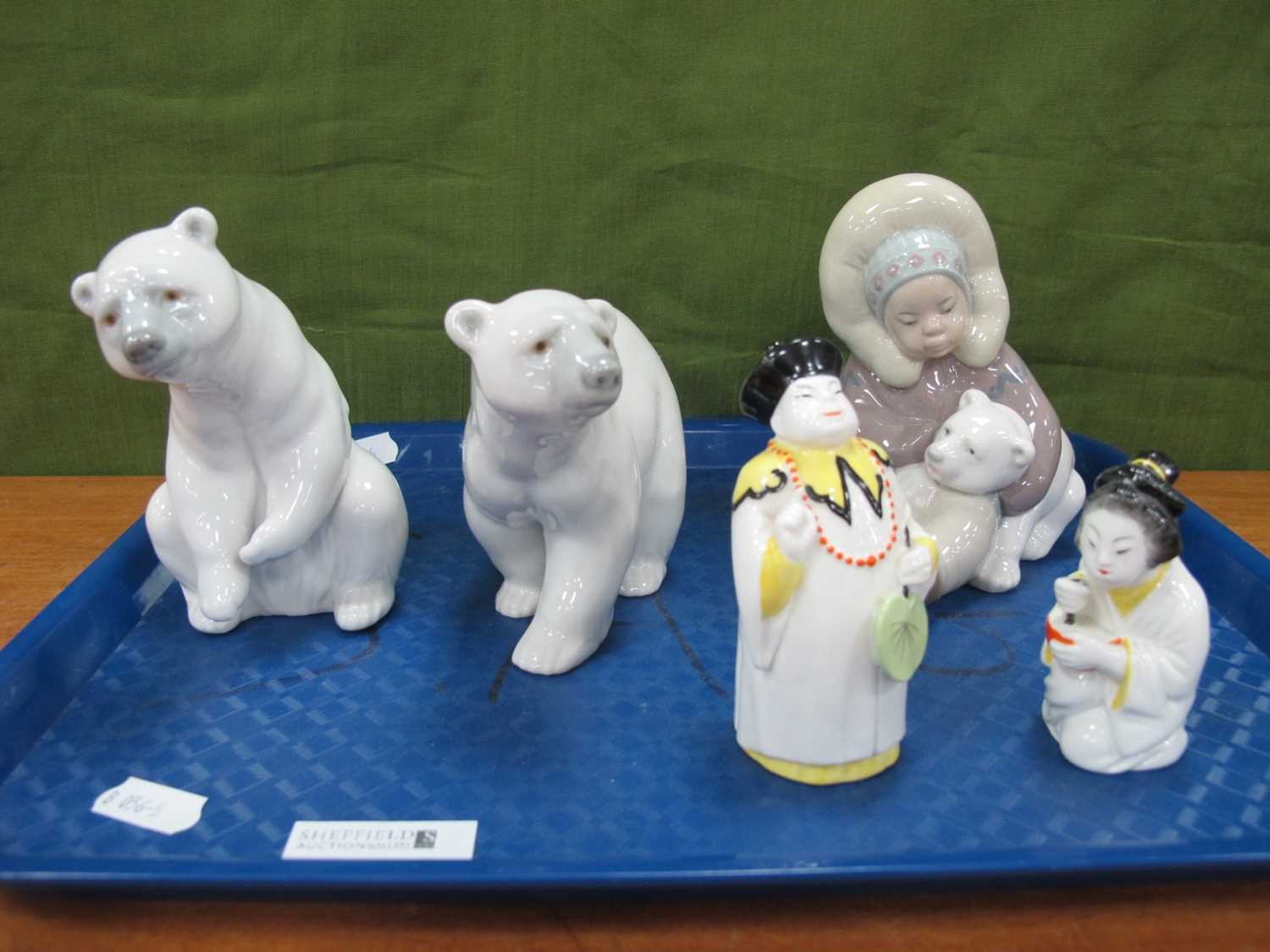 Lladro Eskimo Girl with Polar Bear, and two Lladro polar bears, Royal Worcester Nandarin and