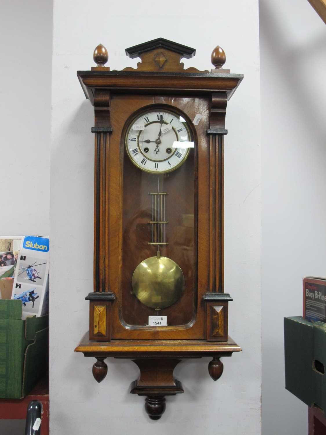 XIX Century Walnut Vienna Wall Clock, with an enamel dial, Roman numerals, arched glazed door,