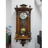 XIX Century Walnut Vienna Wall Clock, with an enamel dial, Roman numerals, arched glazed door,