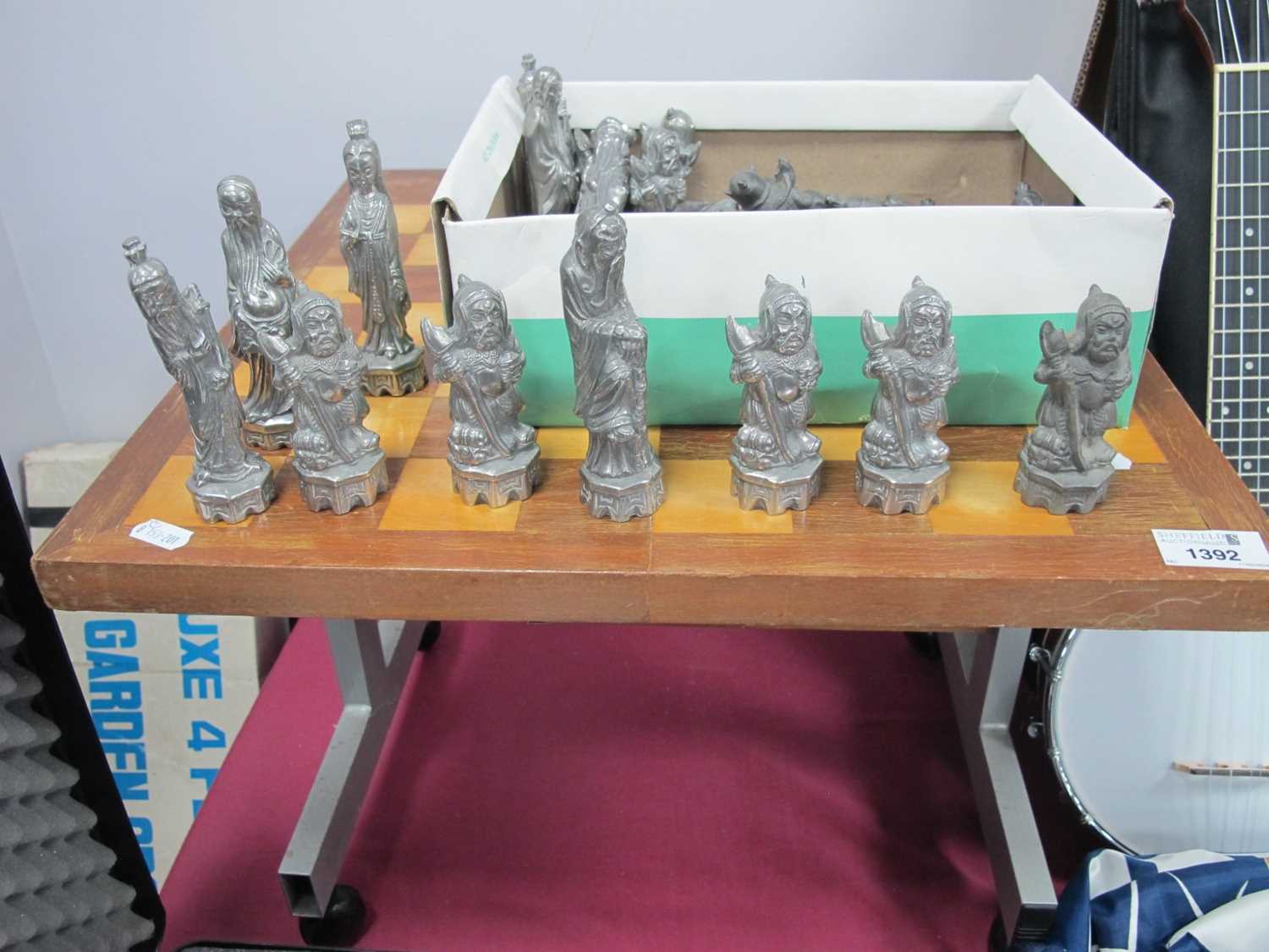 Pewter Chess Set, in the form of Chinese Warriors, together with a chess board.