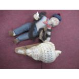 Large Mounted Seashell, together with a fisherman doll. (2).