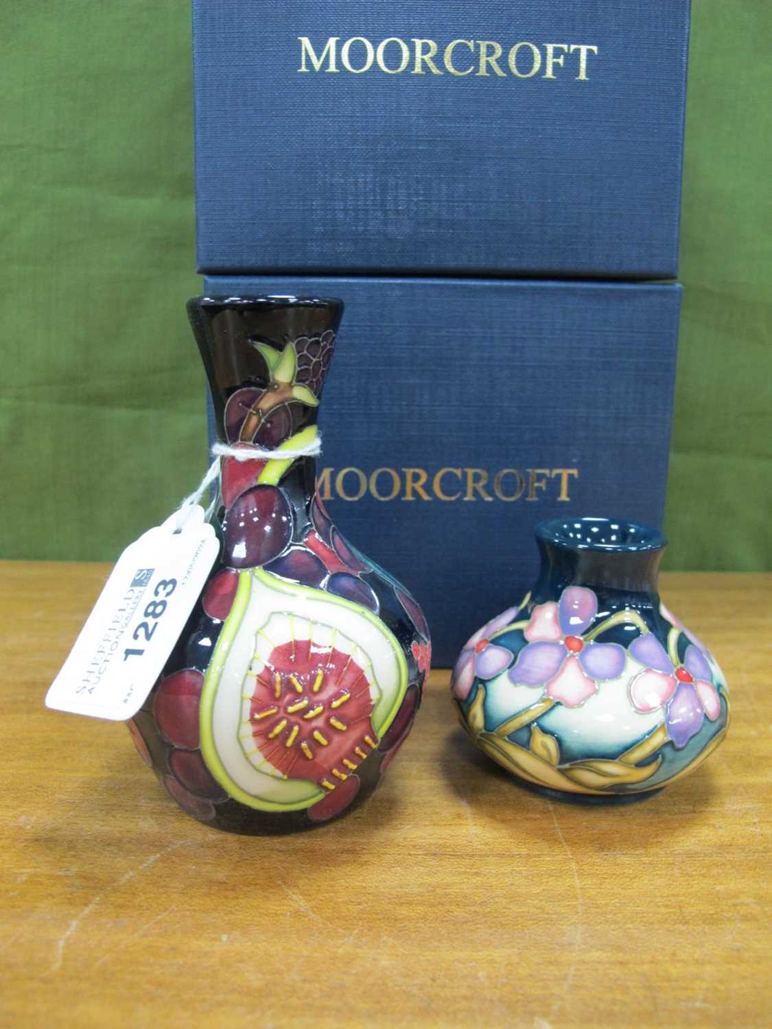 A Moorcroft Pottery 'Pomegranate' Pattern Small Bud Vase, impressed and painted marks, mark for Emma