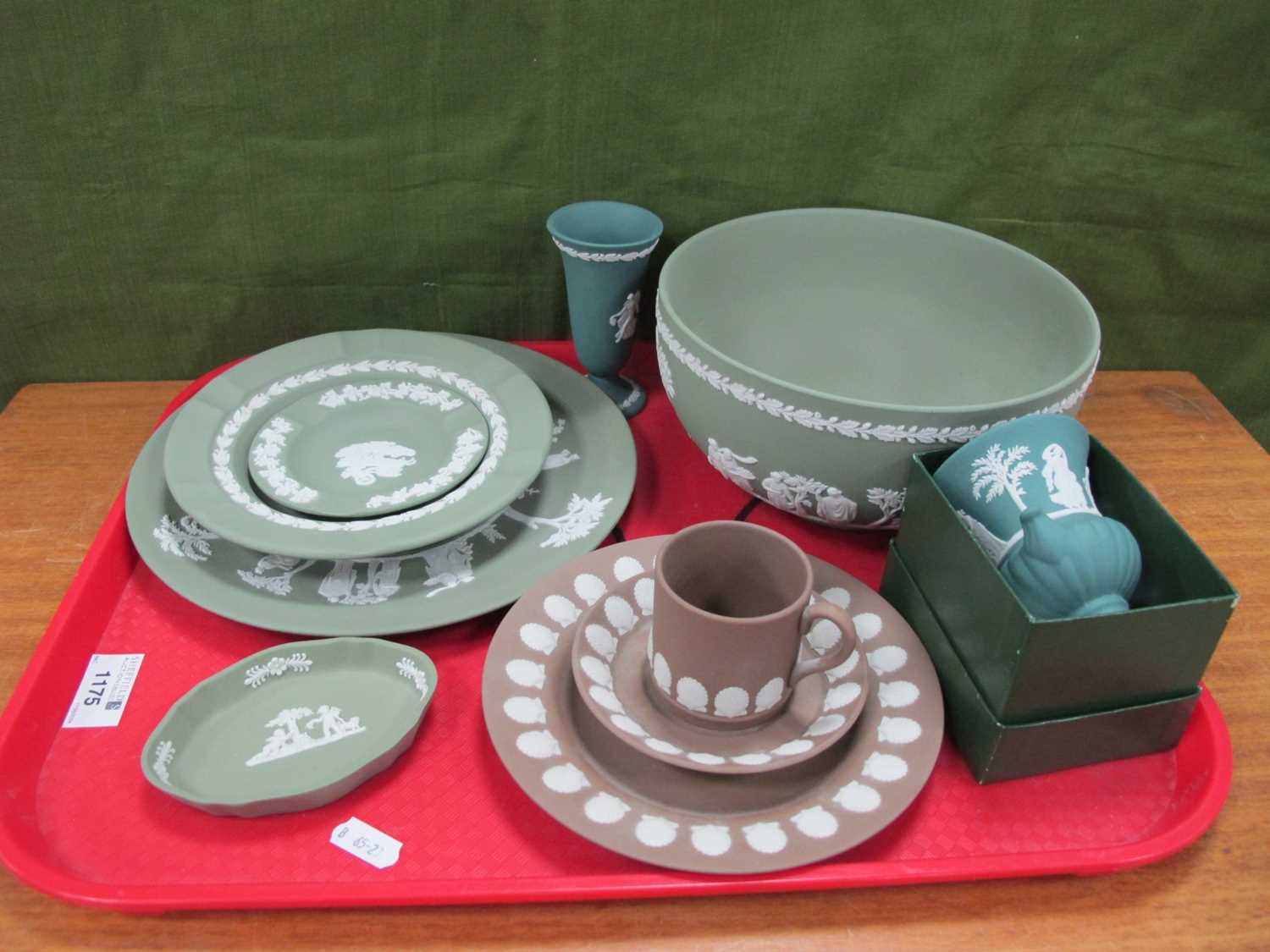 Wedgwood Jasperware: brown trio with applied shell motif, green bowl and plates, vases, etc:- One