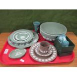 Wedgwood Jasperware: brown trio with applied shell motif, green bowl and plates, vases, etc:- One
