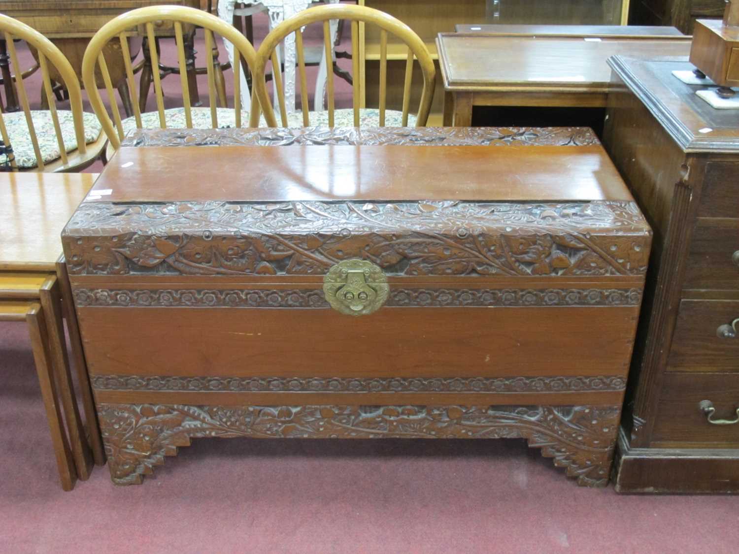 XX Century Carved Camphor Wood Blanket Box, with a hinged lid, brass lock plate, on bracket feet,