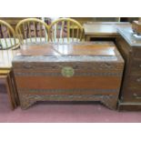 XX Century Carved Camphor Wood Blanket Box, with a hinged lid, brass lock plate, on bracket feet,
