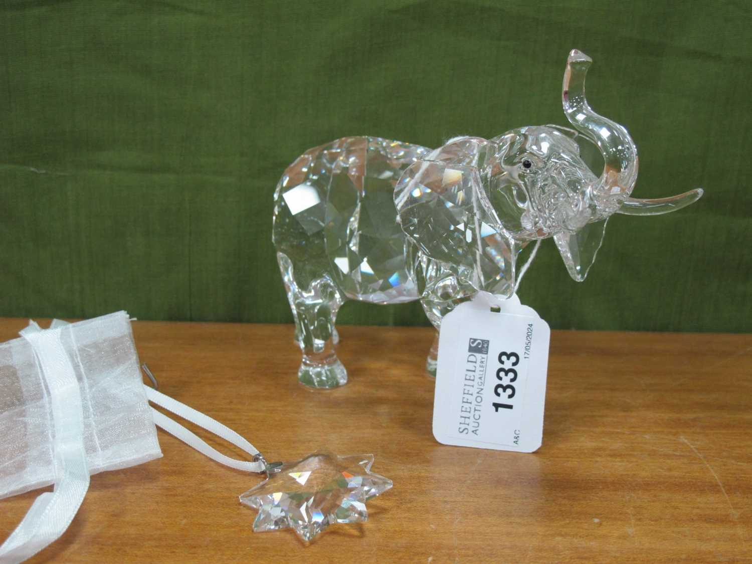 A Swarovski Crystal Model of an Elephant from the Rare Encounters Series, 11.5cm, high; a