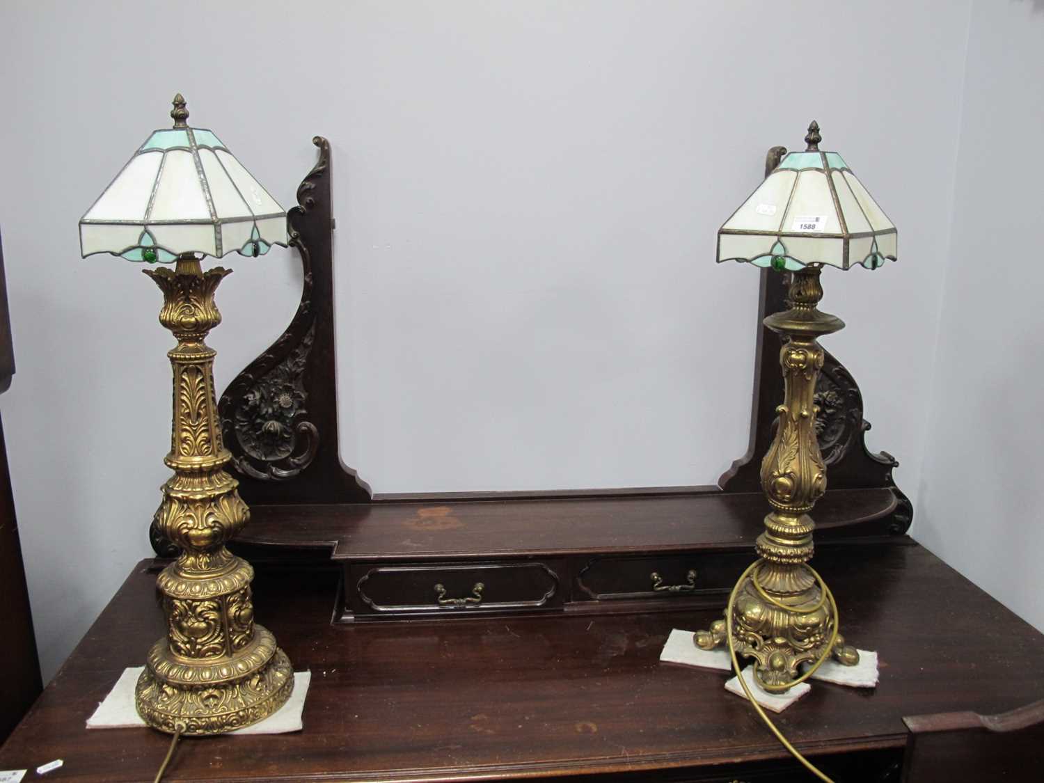 Pair of Gilt Metal Table Lamps, each with Tiffany style shade, 69cm high. (2)