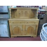 Light Oak Court Cupboard, top with a single cupboard door, with arched decoration, over two small