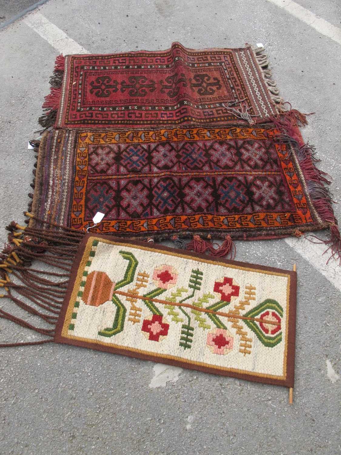 Two Carpet Bags, approximately 105 x 56cm. Wool wall hanging (3).