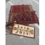 Two Carpet Bags, approximately 105 x 56cm. Wool wall hanging (3).