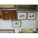 Three Eskimo Prints, pair of early XX Century pottery stag scene wall plaques in oak frames, overall