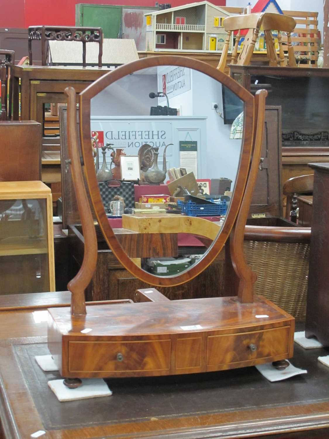 An XVIII Century Mahogany Dressing Table Mirror, with shield shaped mirror, crossbanded top and