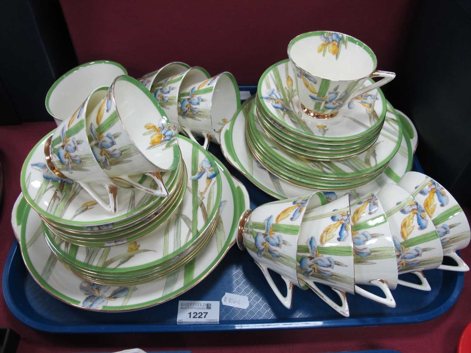 Royal Doulton 'Iris' Pattern Tea Service, comprising two bread and butter plates, twelve tea plates,