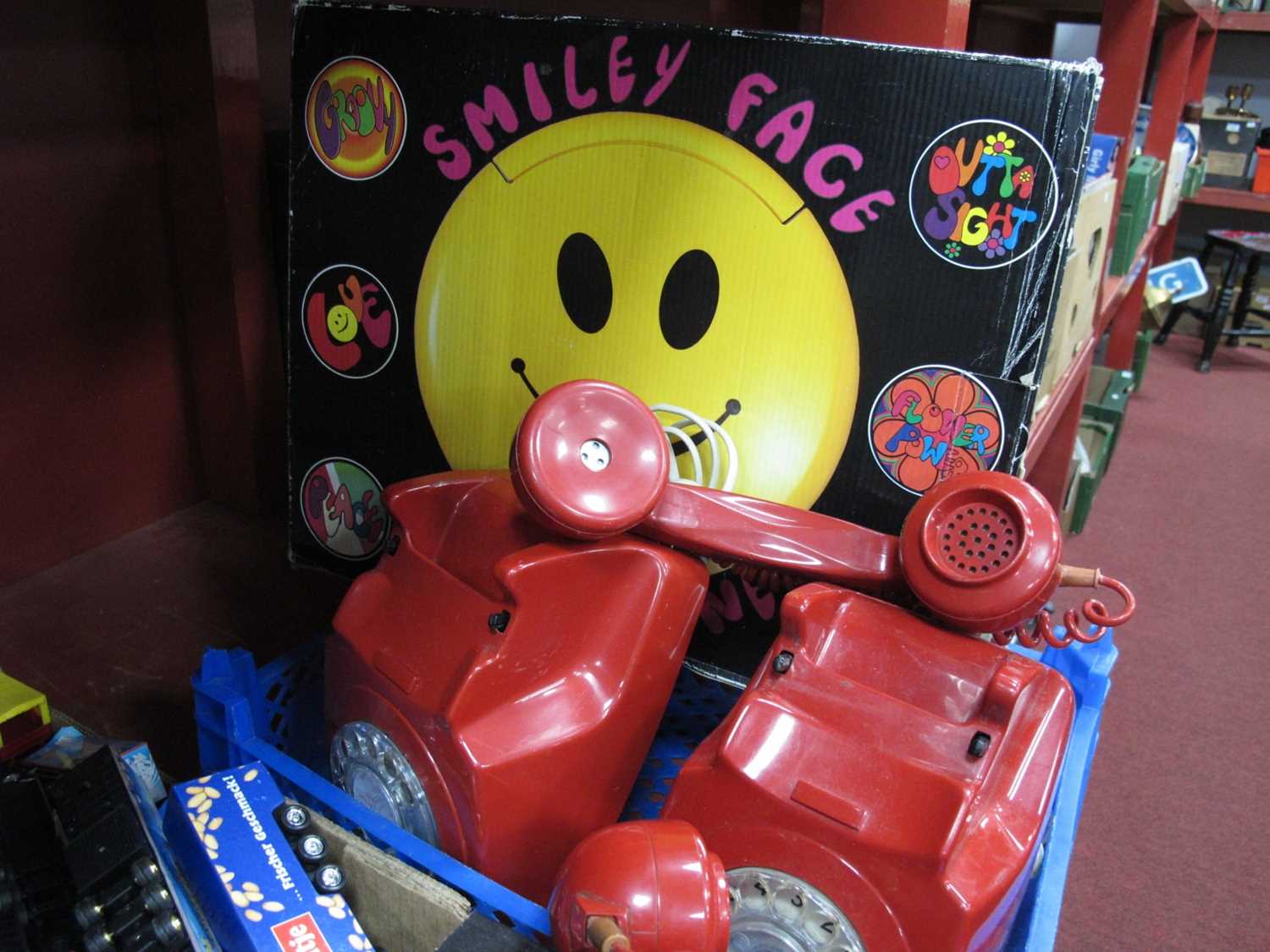 Two Red Plastic Anvil Telephones, Smiley Face boxed telephone.