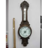 Early XX Century Carved Oak Two Dial Aneroid Barometer, 86cm high.