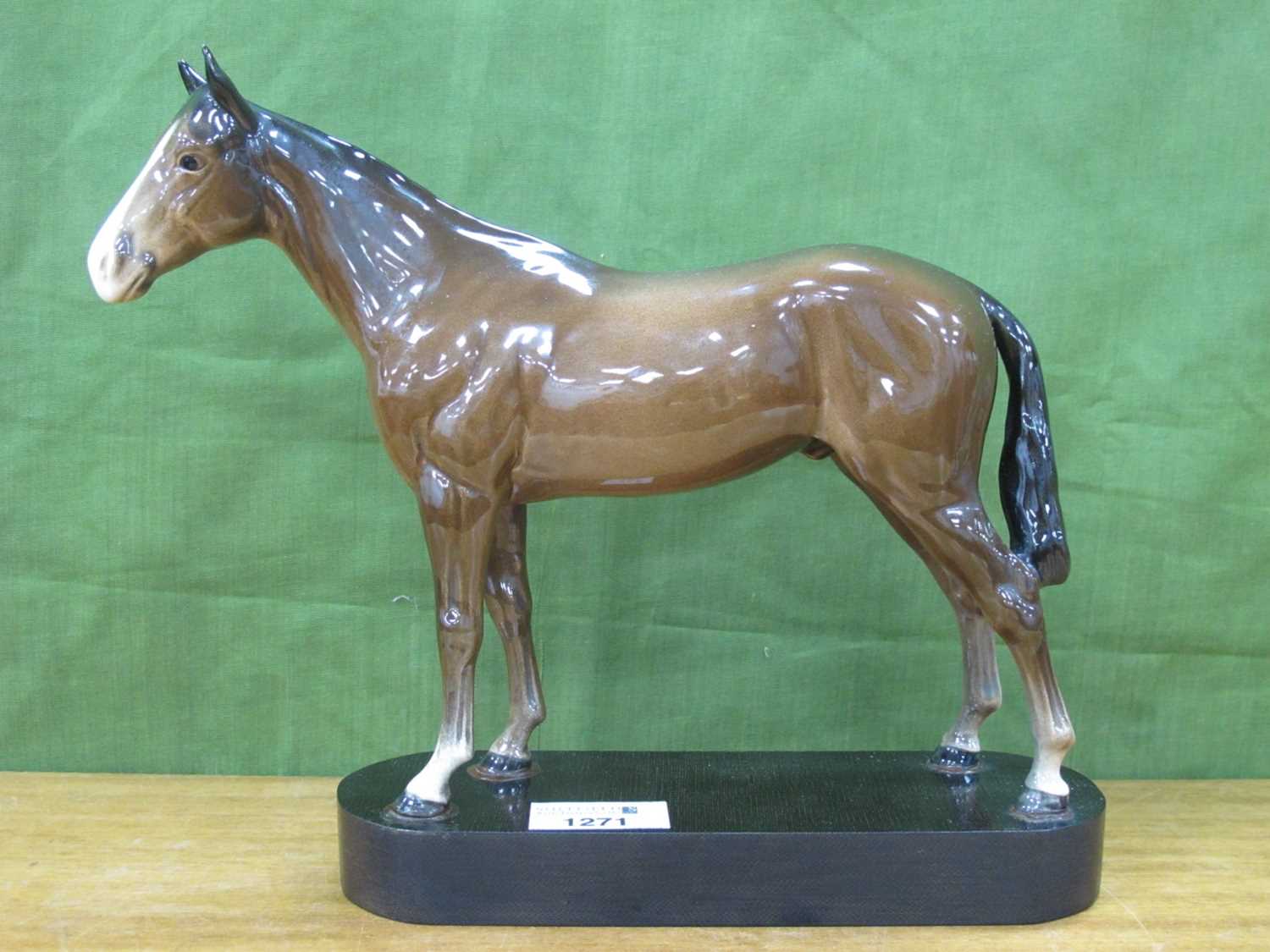 Beswick Pottery Chestnut Horse, on oval wooden plinth, overall 23cm high.