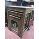 Oriental; A Nest of Tables, the tops with carved decoration, on square supports.