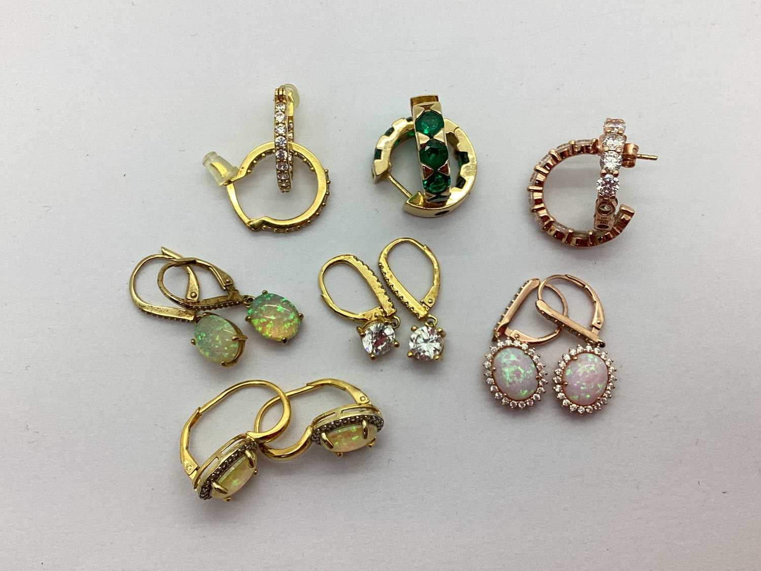 A Collection of Gilt Coloured "925" Earrings, to include stone set drops, sleeper hoops etc.